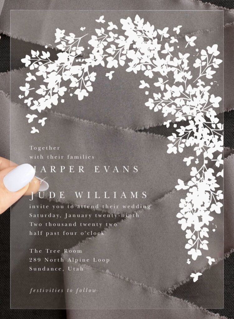 Black and white wedding invitation with floral arch