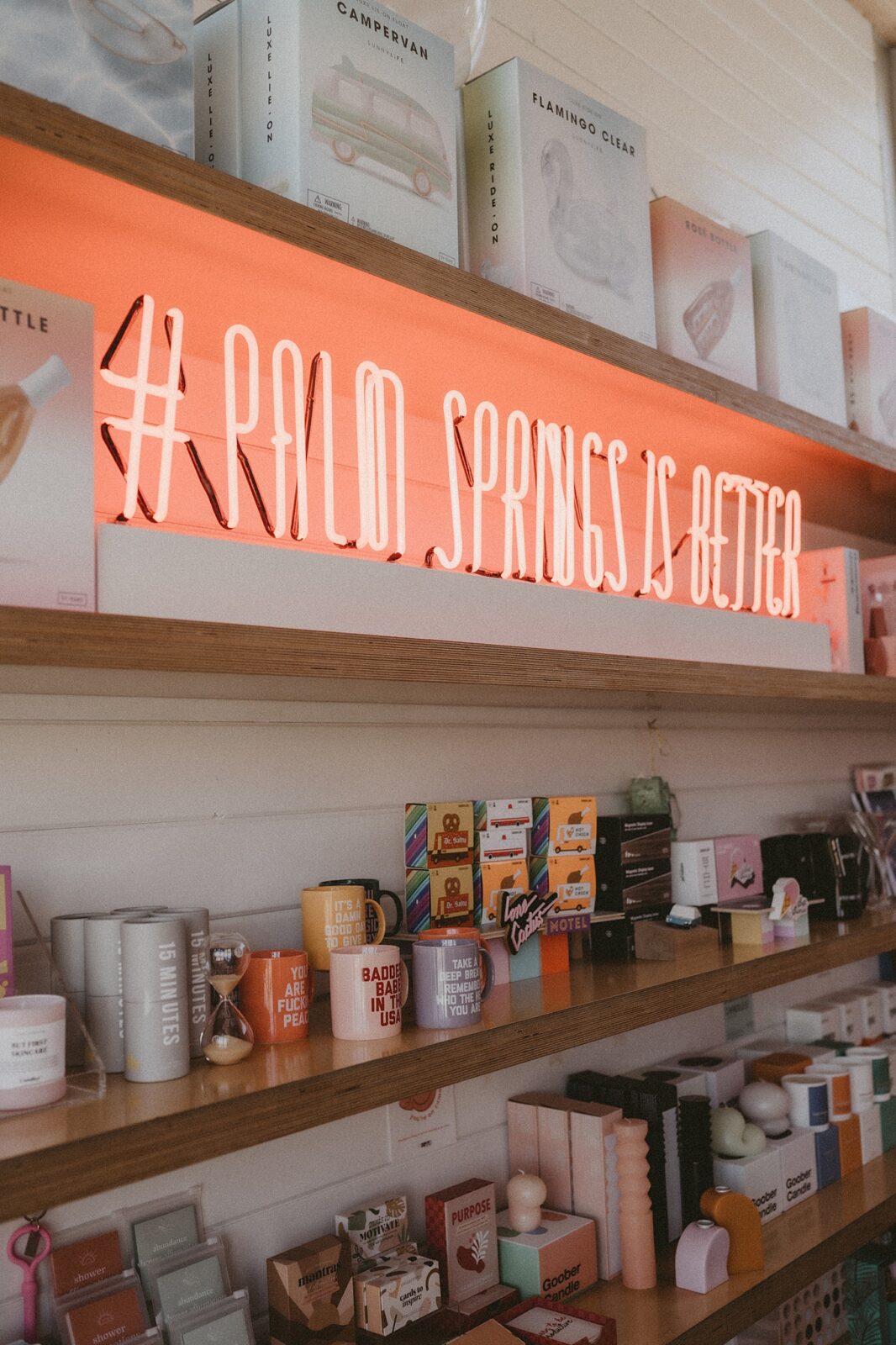 Palm Springs ice cream and shop, red neon sign saying palm springs is better.