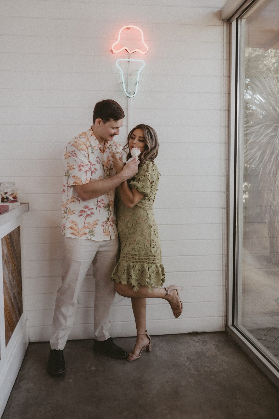 Couple sharing ice cream cone together in a Palm Springs shop