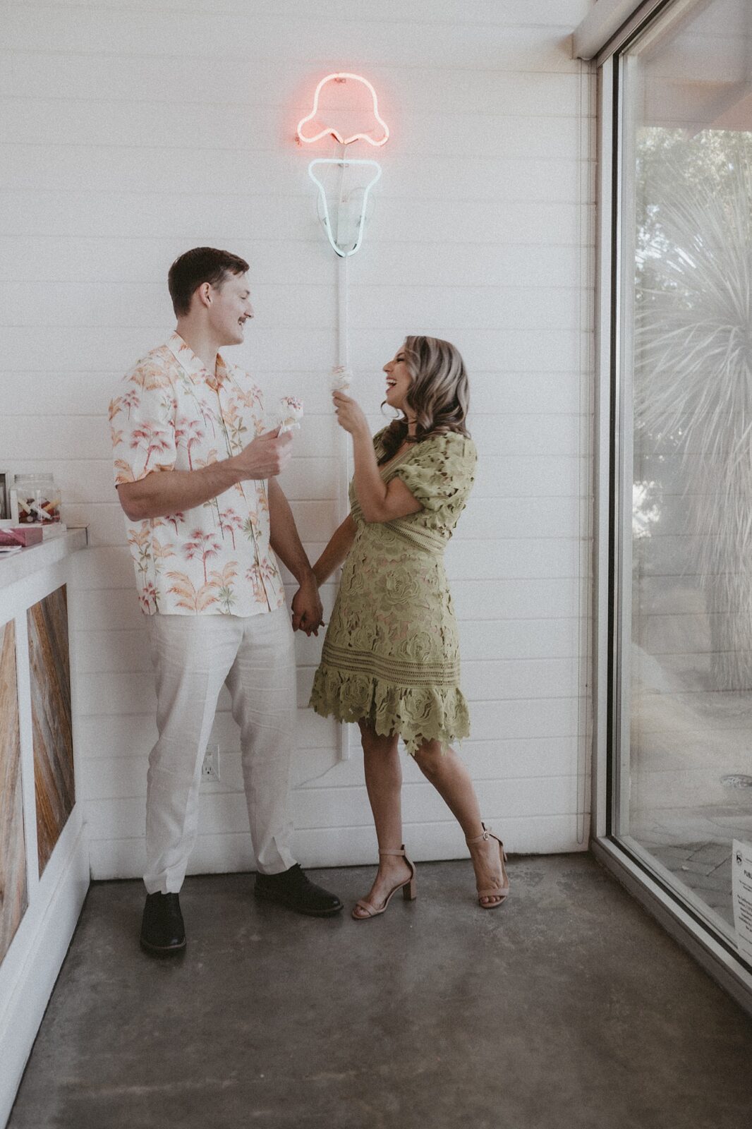 Couple is laughing while sharing ice cream