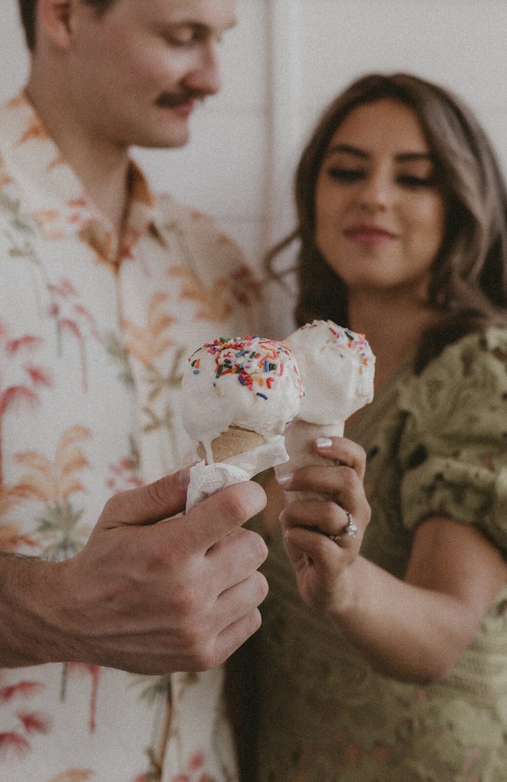 Close up of ice cream cones being cheersed