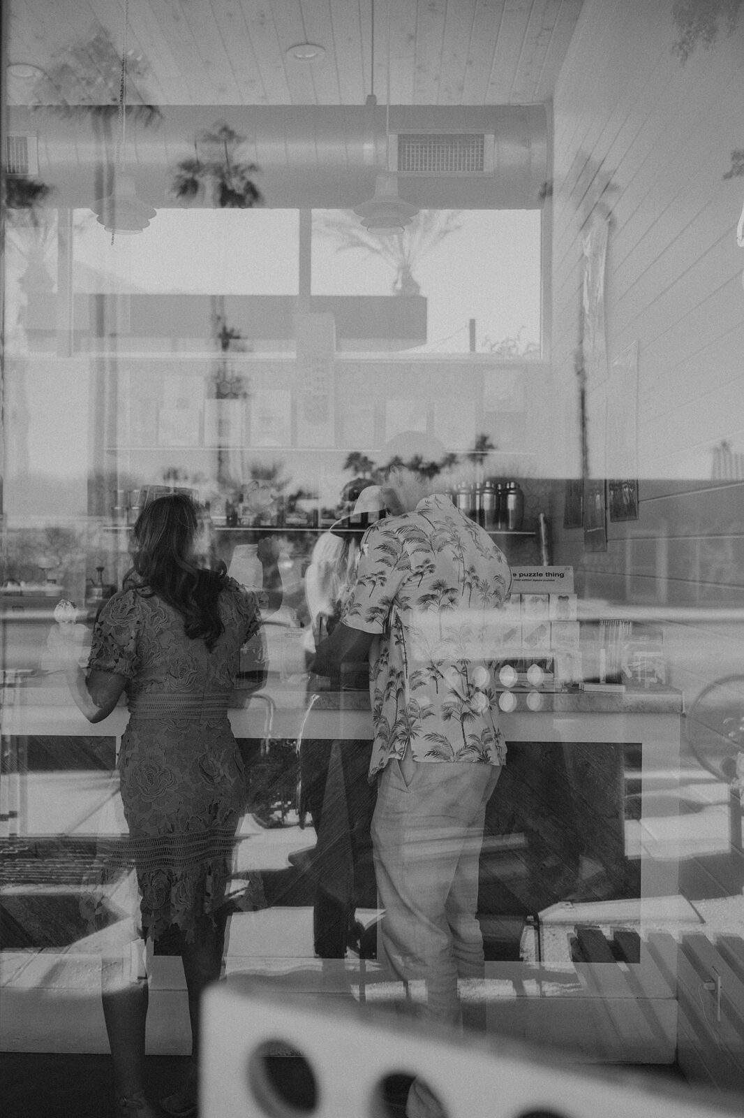 Couple is choosing an ice cream flavor over the counter in Palm Springs ice cream shop