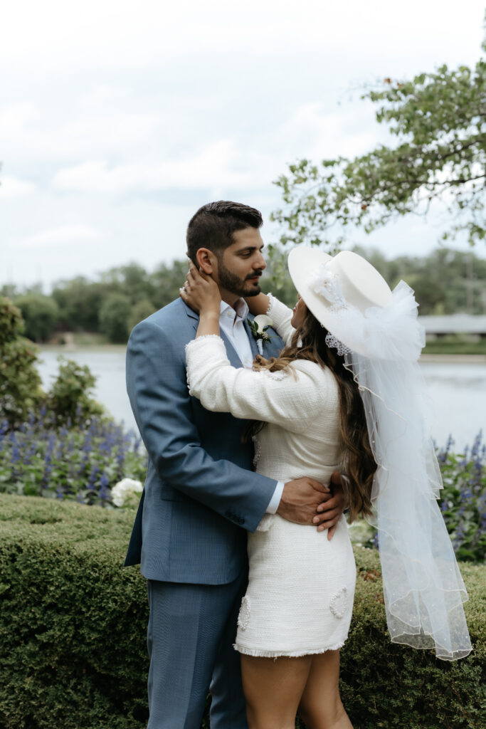 An intentional wedding portrait of a couple embracing and staying present during their outdoor celebration.