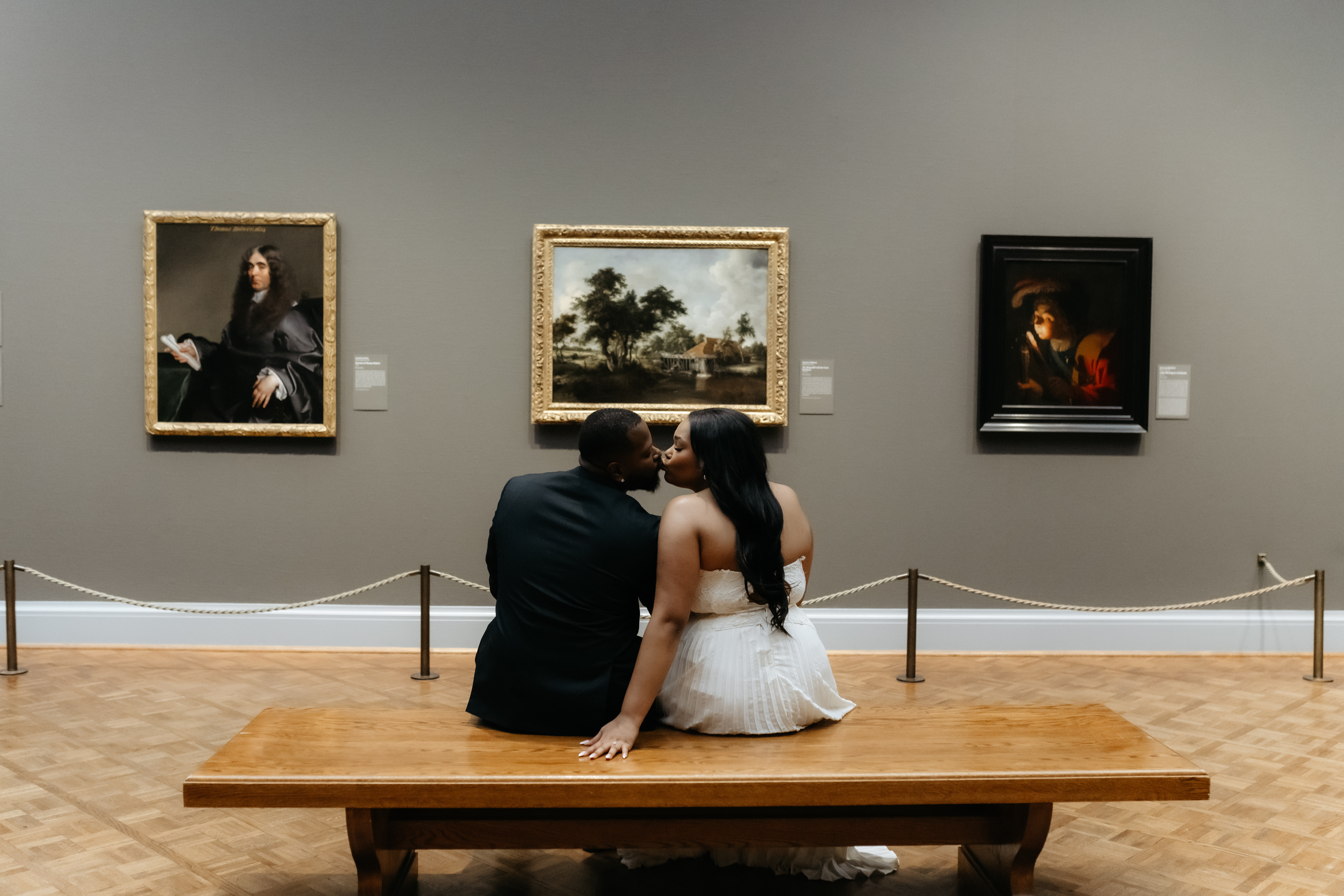Bride and groom kissing and staying present at the Art Institute of Chicago.