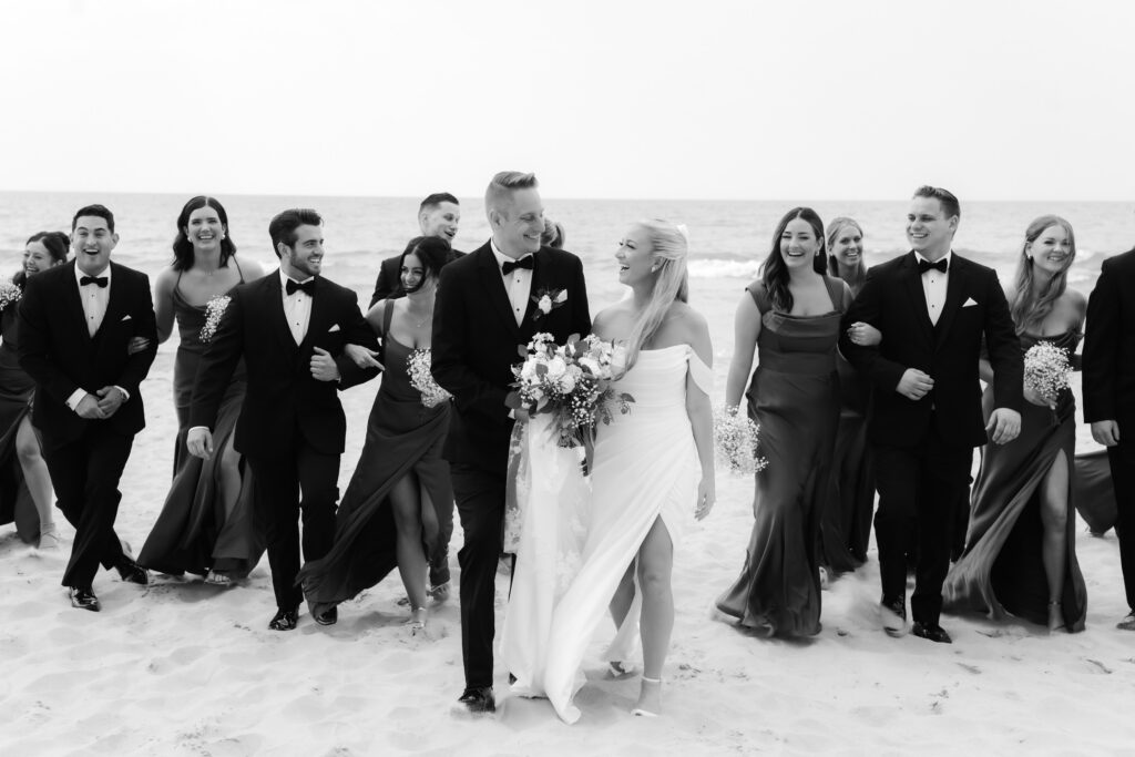 Joyful wedding shooting at the beach in timeless monochrome wedding photography style.